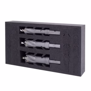 Foam insert holding three gray router bits with square shanks arranged in a black foam case