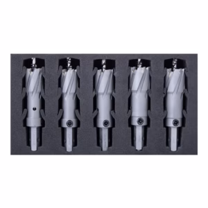 Five gray dental burs laid out in a foam tray, ready for use in procedures.