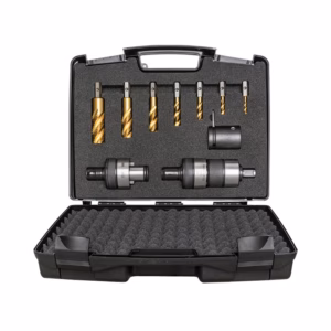 Open tool case showing a drill bit set with multiple gold-coated twist bits and two chucks in a foam insert, ready for use in drilling tasks.