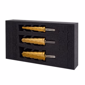 Foam insert holding three brass lock cylinders arranged in a row with dark packaging behind them.