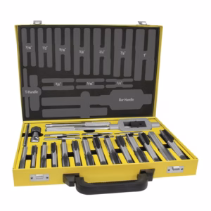 Open yellow tool case with black handle containing an assortment of drill bits and tools, neatly organized in foam slots inside the lid.
