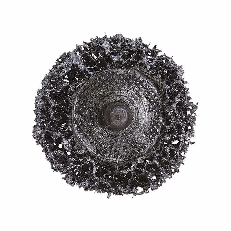 CGSPD50BC_3 - Alpha Tools Top-down view of a round, textured drainage cover surrounded by jagged black debris or rubble.