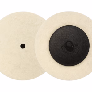 Two overlapping beige circular discs with black centers, side by side overlap visible on the left and right halves.