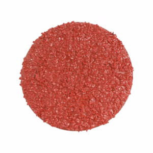 Round raw beef patty with a crumbled textured surface on a white background