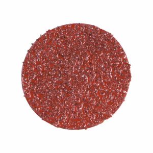 Round red dessert with a glossy, bumpy surface.