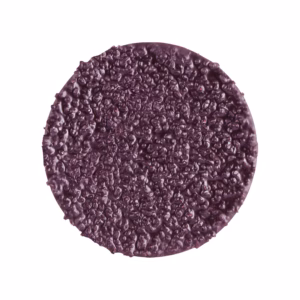 Round purple veggie burger patty with a rough, crumbled surface on a white background.
