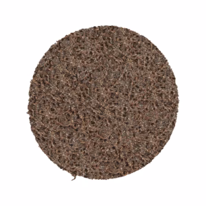 Brown circular abrasive scouring pad used for cleaning dishes and surfaces.