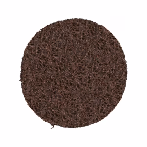 Round dark brown porous scrub pad with a rough, textured surface used for washing dishes or surfaces.