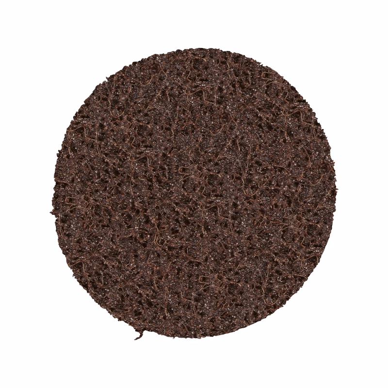 GSP75EC - Alpha Tools Round dark brown porous scrub pad with a rough, textured surface used for washing dishes or surfaces.