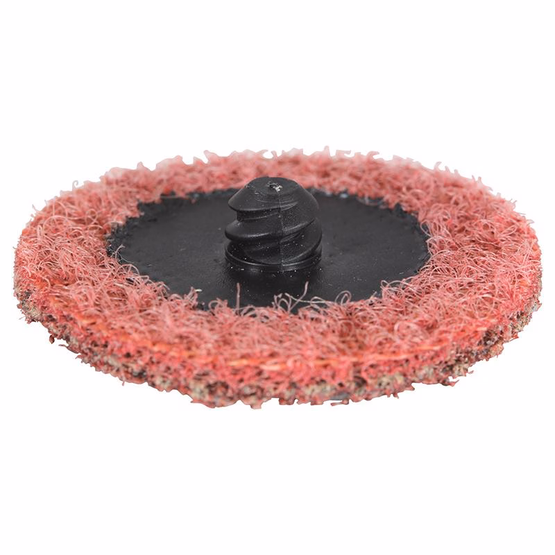 GSP75EC_5 - Alpha Tools Red abrasive flap wheel with a black central arbor used for grinding and smoothing surfaces in a workshop.