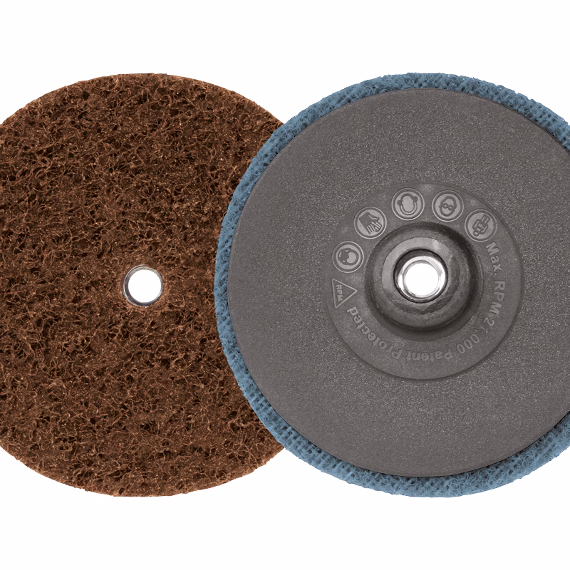GTKSP75EC - Alpha Tools Two circular sanding discs overlapping: a brown abrasive disk and a blue-backed backing pad, used for orbital sanding and polishing