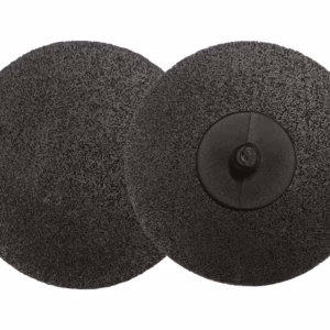 Two black circular grinding/disc pads with rough abrasive surfaces overlap; the right disc shows a central hub.