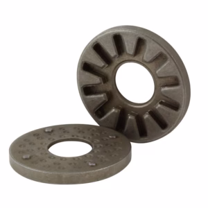 Two circular metal washers with central holes; one has inner radial teeth, the other features a dotted textured face.