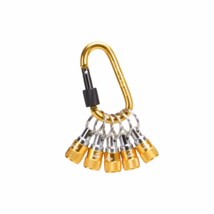 Close-up of gold and silver climbing hardware (carabiner hooks and metal rings) clustered together, showing knurled gold connectors and a black grip piece in the foreground.